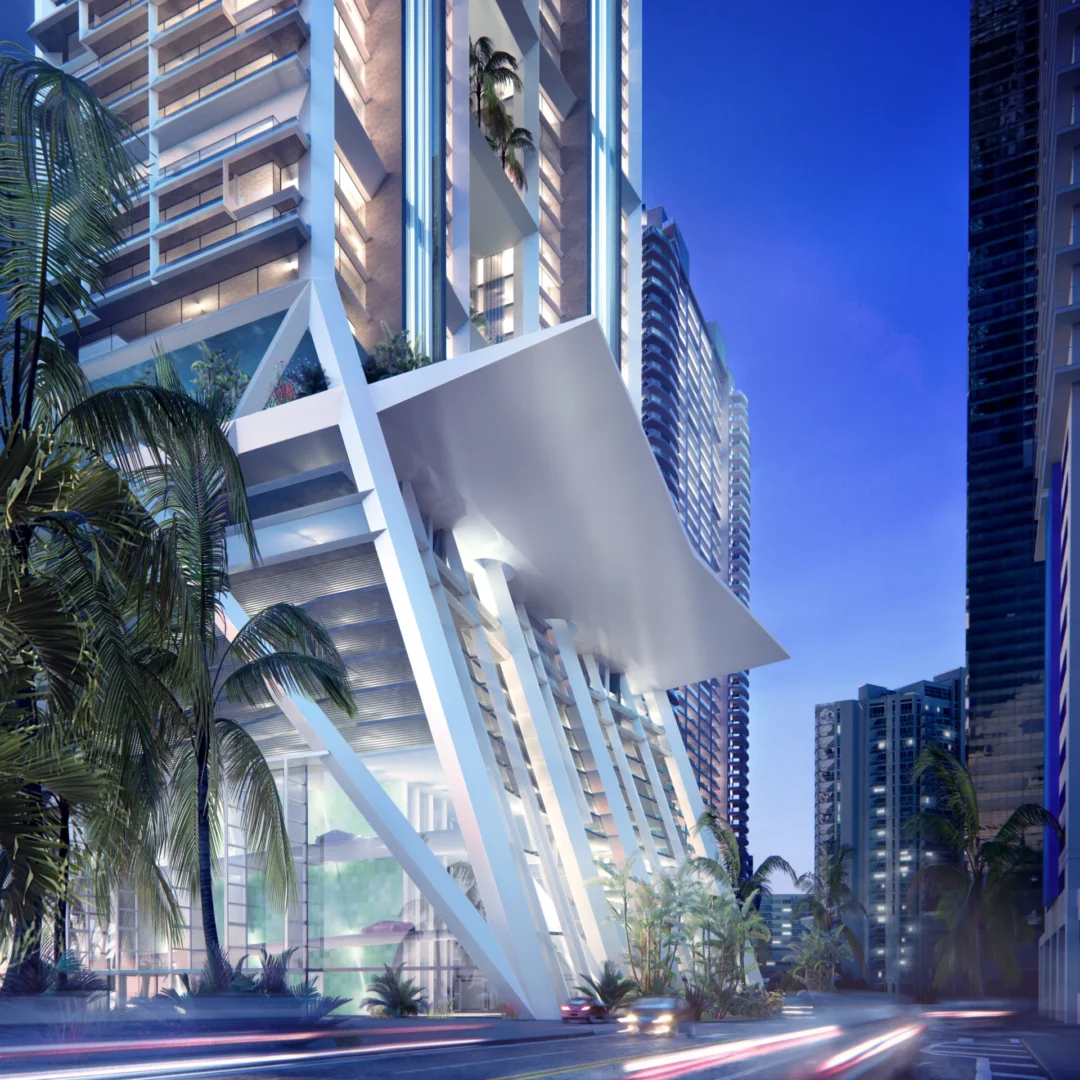 White geometric architectural features of 1201 Brickell stand near palm trees and a street with blurred light trails