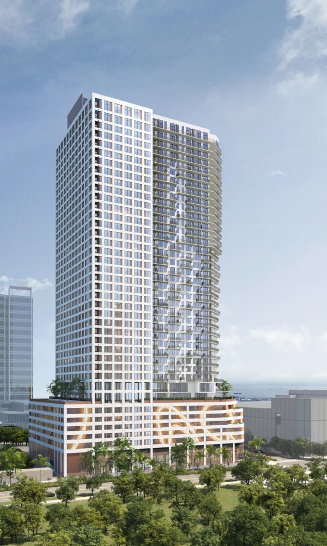 A tall building for 1775 Biscayne features white and glass facades above green trees under a blue sky