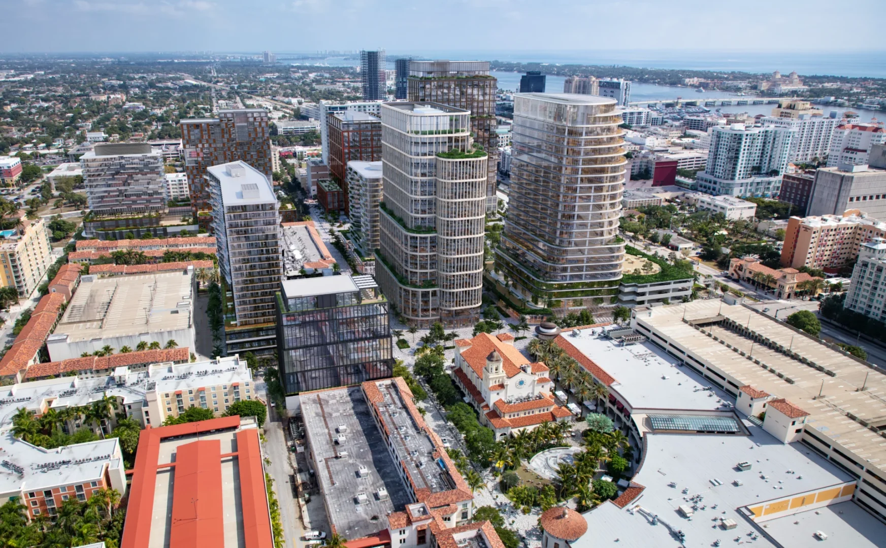 Skyscrapers and urban structures comprise the City Place cityscape overlooking a distant waterfront