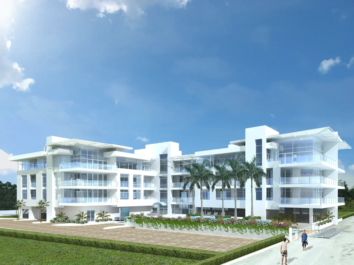 El edificio blanco de varias plantas «Ice Condominiums» cuenta con balcones acristalados y palmeras bajo un cielo azul, junto a dos personas que caminan.