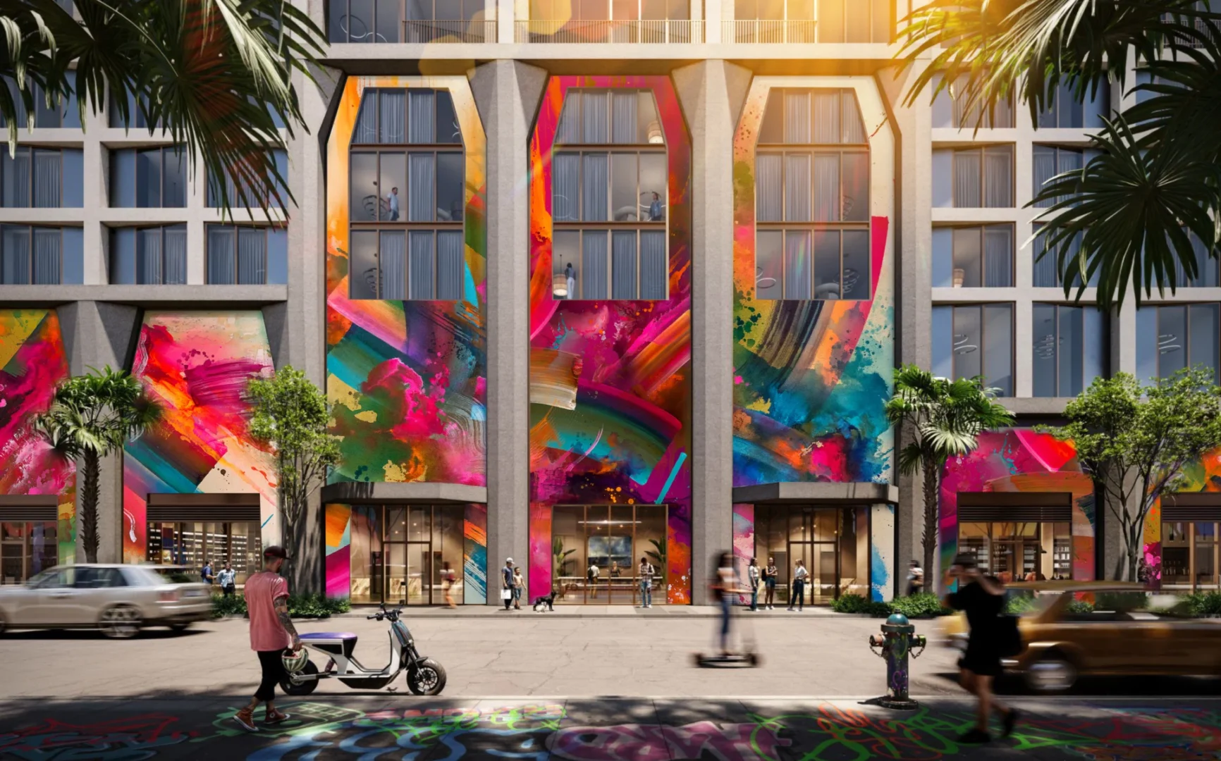 Coloridos murales cubren la fachada del hotel y residencias The Cloud One de Wynwood, junto a los peatones y las palmeras.