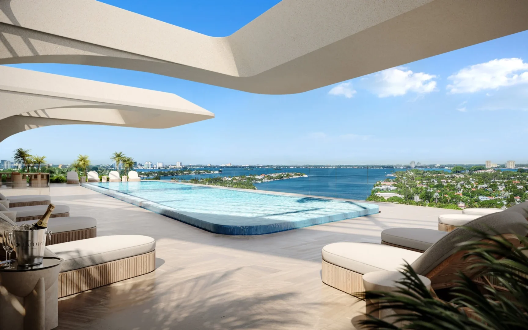 White architectural overhangs frame an infinity pool and lounge chairs on a terrace at The Delmore