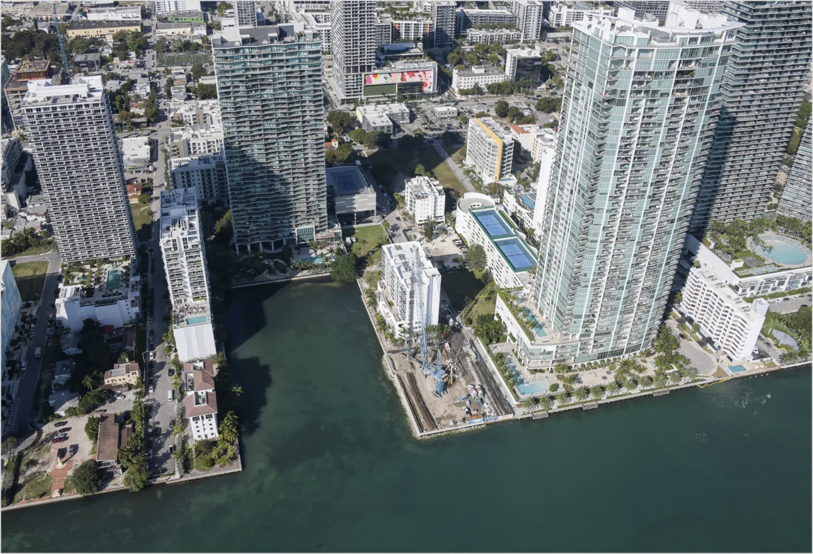 Tall skyscrapers and a waterway border the urban landscape near Villa Miami