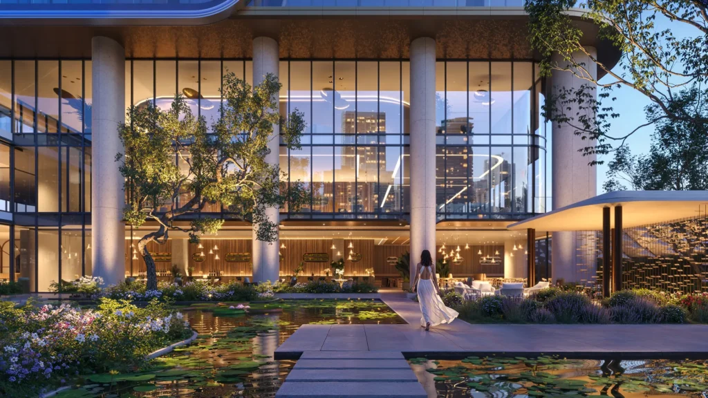 Massive concrete columns support a glass building overlooking an outdoor terrace where a woman walks near a lily pond